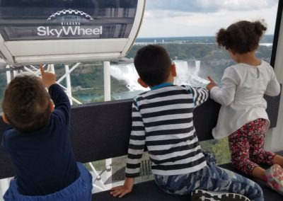 children overlooking falls from SkyWheel